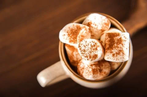 Concept with marshmallows in a circle on a dark background. Autumn, coffee, tea, Stock Photos