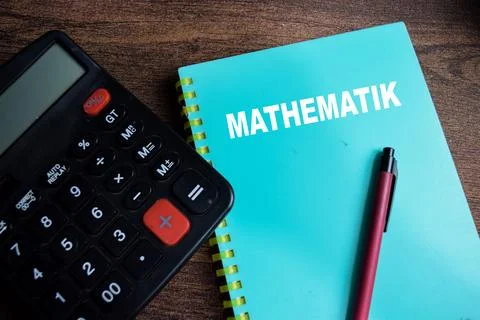 Concept of Mathematik write on book isolated on Wooden Table. Stock Photos