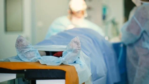 Concept of medical error, mortality  operating room. patient's legs  surgery Stock Footage 107434428