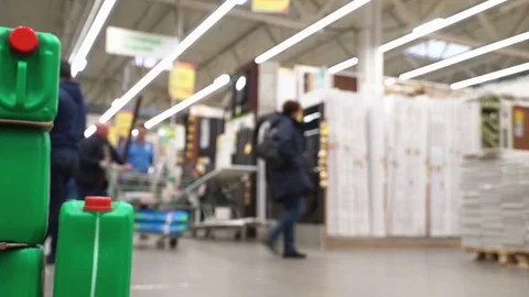 Concept men shopping in construction hypermarket. Men are shopping for repairs Stock Footage 77209402