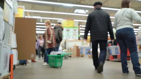 Concept men shopping in construction hypermarket. The loader is driving through Stock Footage 78019408