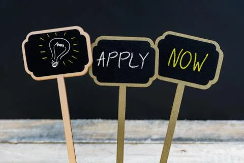 Concept message APPLY NOW and light bulb as symbol for idea Stock Photos