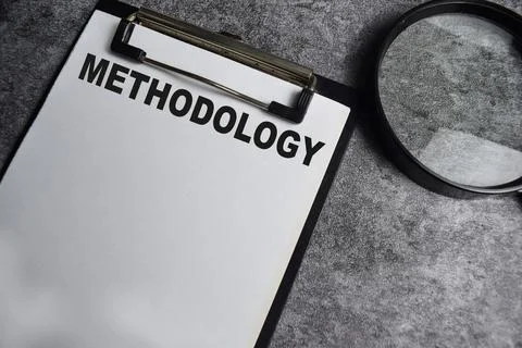 Concept of Methodology write on paperwork with a magnifier Stock Photos