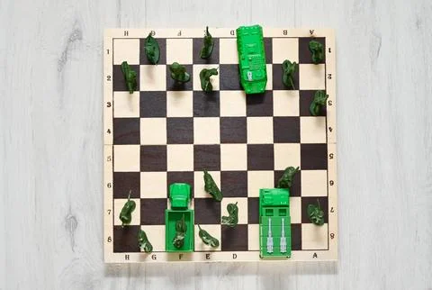 Concept of military aggression on the chessboard. Stock Photos