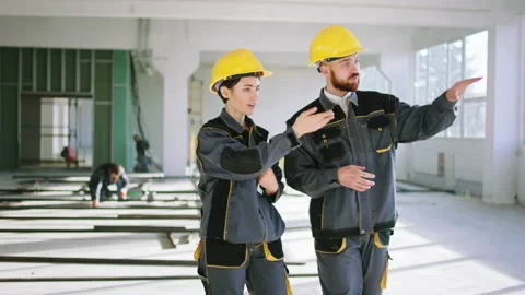 Concept of modern architecture at construction site young team of engineers man Stock Footage 170139245