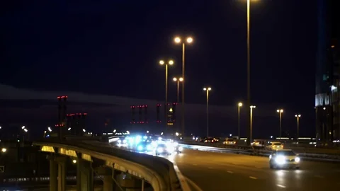Concept of modern city life. Train under bridge with bright windows. People go Stock Footage 72422982