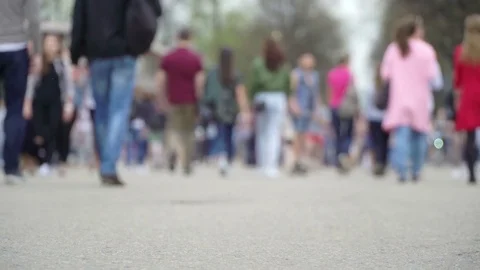 Concept modern holidays at weekends. Crowd walking in city park. Youth Stock Footage 76026216