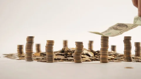 The concept of money. Columns of gold coins in the form of skyscrapers or Stock-Footage 122714341
