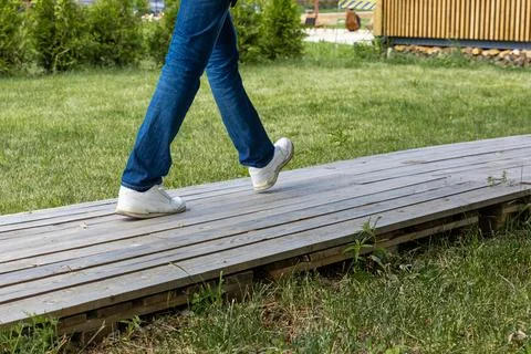 The concept of movement and development in harmony with nature. A man's legs  Stock Photos