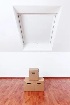 Concept of moving and assembling, empty room with moving boxes Stock Photos