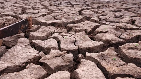 The concept of natural disasters: a Pickaxe to the arid ground  Stock Footage 124248625