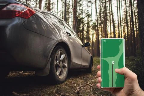 The concept of navigation on maps - a mobile phone with gps navigator in hand Stock Photos