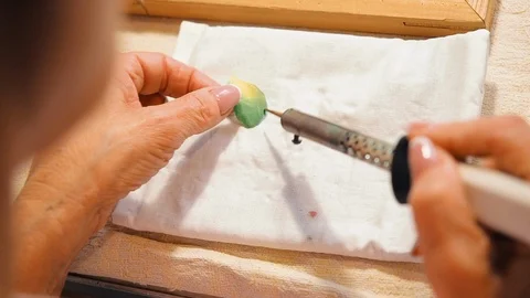 Concept of needlework, making flowers and leaves from dyed fabric. Woman creates Stock Footage 115301860
