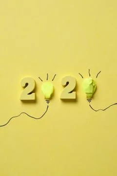 The concept of new ideas. Abstract two paper light bulb with 2020 numbers on  Stock Photos