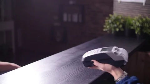 Concept of NFC and contactless payments. Customer paying with smartphone Stock Footage 102931385