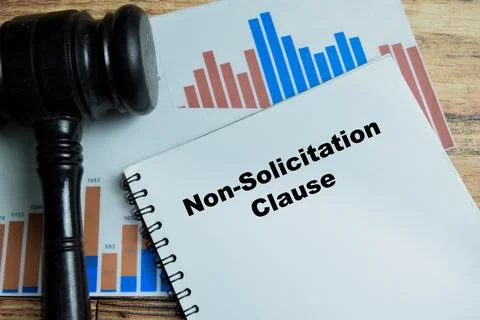 Concept of non-solicitation clause write on book isolated on Wooden Table. 스톡 사진