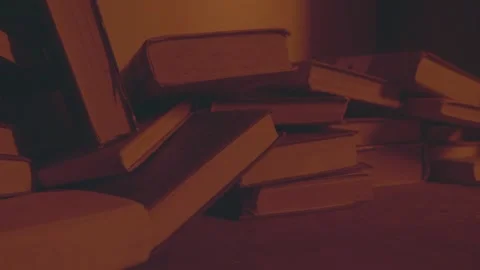 Concept of old books in library. Dust lies on books, dim light falls on them by 스톡 동영상 233719053
