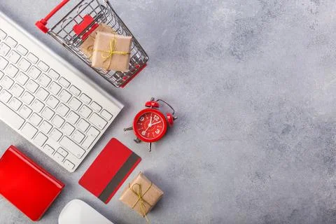 Concept online shopping buying presents. Red credit card, keyborad and christmas Stock Photos