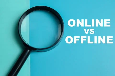 Concept of online vs offline write on color background with magnifying glass. Stock Photos