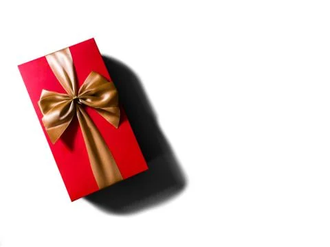 Concept or idea of flat view of red gift box with gold ribbon or bow. Stock Photos