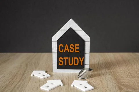 Concept orange words CASE STUDY on black blackboard. Beautiful wooden table Stock Photos