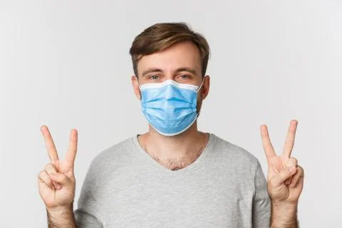 Concept of pandemic, covid-19 and social-distancing. Hopeful worried guy in Stock Photos