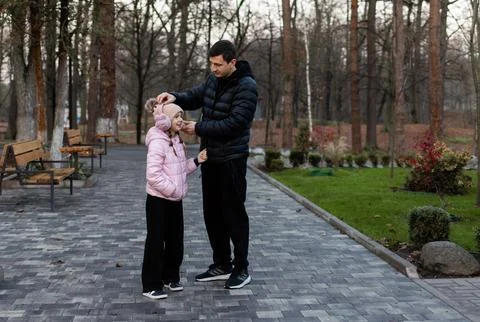 Concept of parenthood and spending time together. Family walk Stock-Fotos
