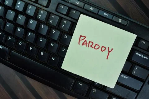Concept of Parody write on sticky notes with keyboard computer Stock Photos