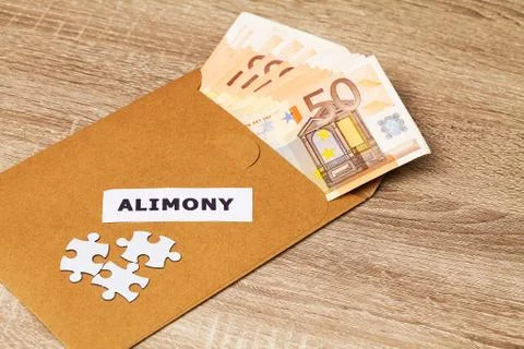 Concept of paying for the elements, money in a paper envelo Stock Photos