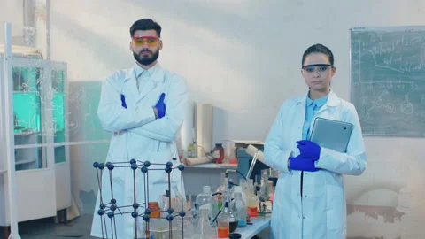 Concept of pharmaceutical industry in front of the camera two scientist standing Stock Footage 153088790