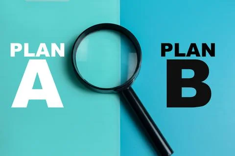 Concept of plan A or plan B write on color background with magnifying glass. Stock Photos