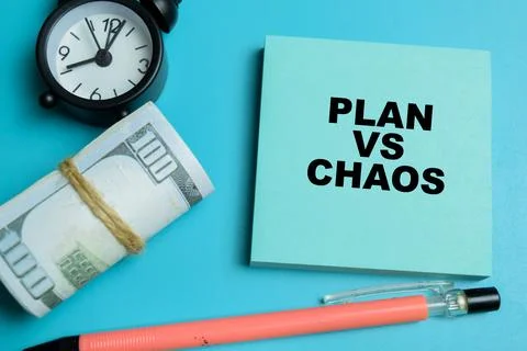Concept of plan vs chaos write on sticky notes isolated on table. Stock Photos