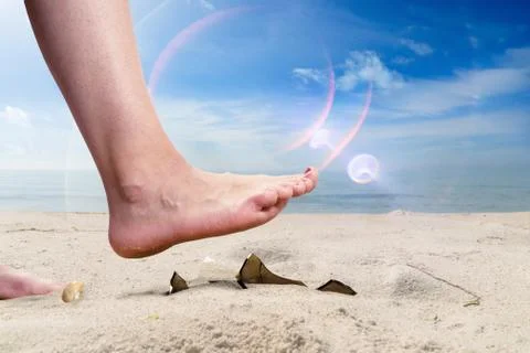 Concept on the pollution of beaches with dangerous objects Stock Photos