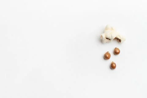 Concept with popcorn and corn - popcorn corn rains from a poped corn Stock Photos