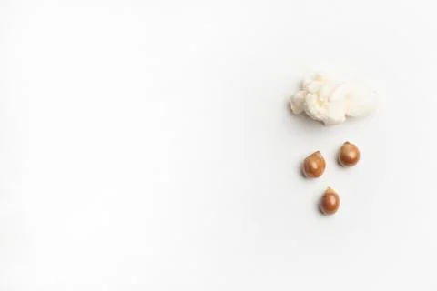 Concept with popcorn and corn - popcorn corn rains from a poped corn Stock Photos