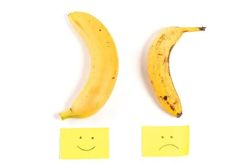Concept of potency, smiley and sad faces with two bananas up and down Stock Photos