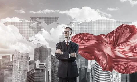 Concept of power and sucess with businessman superhero in big city Stock Photos