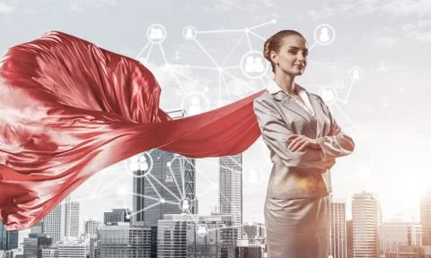 Concept of power and sucess with businesswoman superhero in big Stock Photos