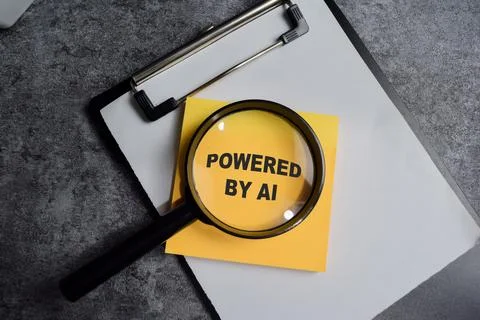 Concept of Powered by AI with magnifier write on clipboard Stockfoto's
