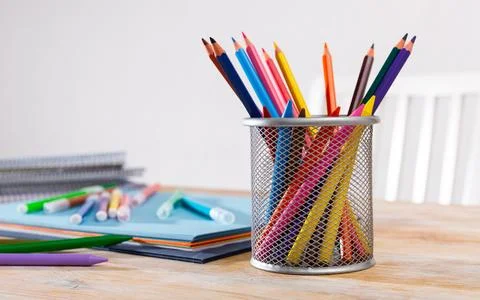 Concept of preparation for school. Different school supplies on the table Stock Photos
