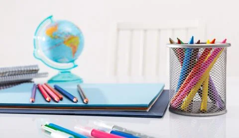 Concept of preparation for school. Different school supplies on the table Stock Photos