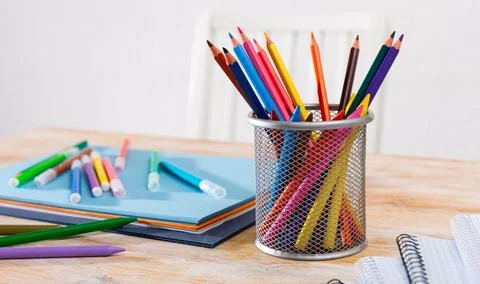 Concept of preparation for school. Different school supplies on the table Stock Photos
