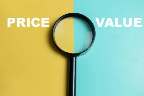 Concept of price or value write on color background with magnifying glass. Stock Photos