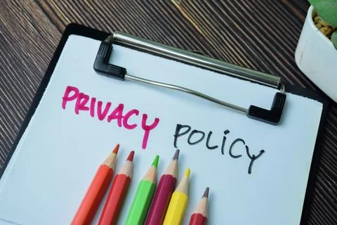Concept of Privacy Policy write on paperwork isolated on Wooden Table. 库存照片