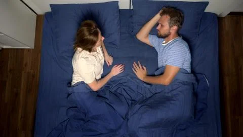 The concept of a problem in a pair. sexual problems. couple in bed. the woman Fotos Stock