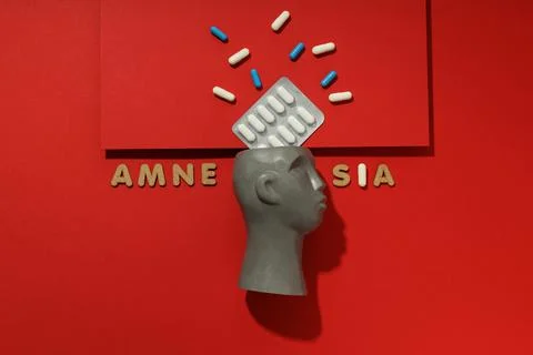 Concept of problems with memory, amnesia disease on red background Foto stock