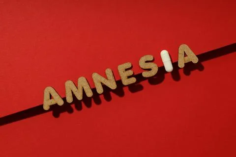 Concept of problems with memory, amnesia disease on red background Foto stock