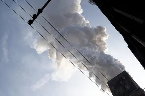The concept of problems related to environmental pollution. Smoking chimney i Stock Photos