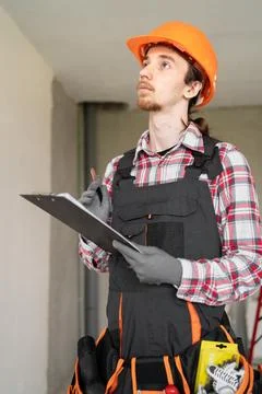 Concept of profession, construction and building. Young male worker or buil.. Fotos de archivo