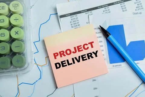 Concept of project delivery write on sticky notes isolated on Wooden Table. Stock Photos